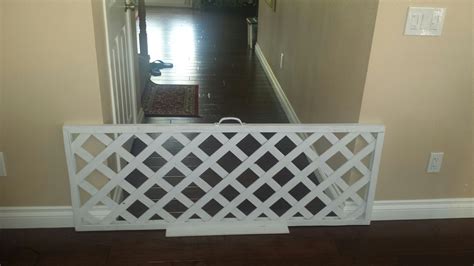 Inexpensive indoor dog barrier / fence for wider hallways under $25. Use a vertical lattice from ...