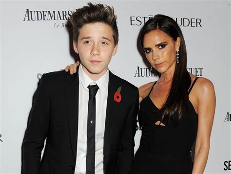 Victoria Beckham posing affectionately with son Brooklyn Beckham at Harper’s Bazaar awards ...