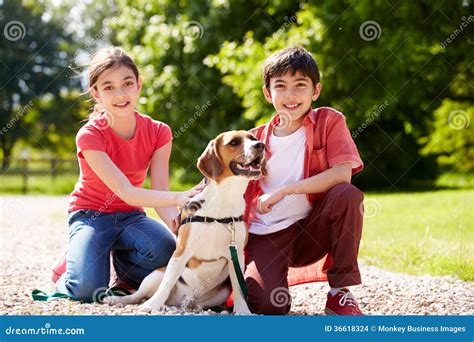 Hispanic Children Taking Dog For Walk Stock Images - Image: 36618324