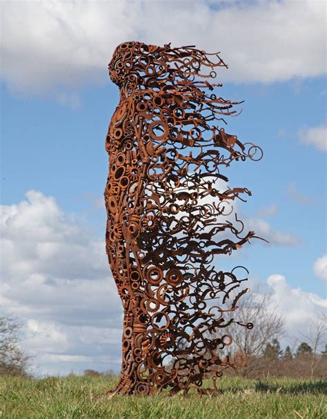 A sculpture of a woman made from scrap metal : r/Damnthatsinteresting