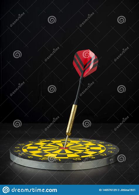 Dart Arrow with Board on Black Granite Stock Image - Image of score, center: 140576129