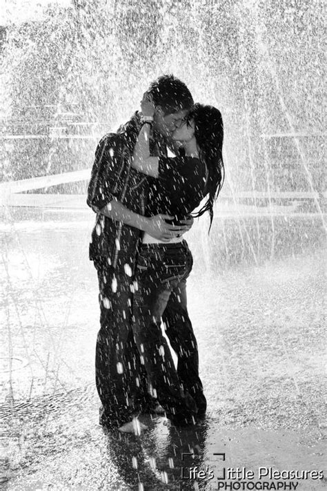 Couples Hugging In Rain