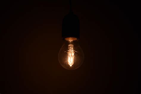 Light bulb in dark room 1416114 Stock Photo at Vecteezy