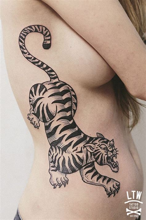 Tiger Side Tattoo | Best tattoo design ideas | Tattoos, Polynesian tattoo meanings, Tattoos for guys