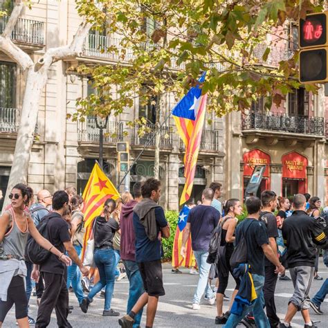 BARCELONA, SPAIN - OCTOBER 3, 2017: Demonstrators Bearing Catalan Flags during Protests for ...