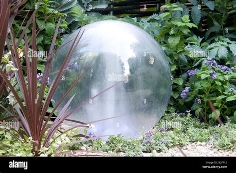 Sphere water feature garden Stock Photo - Alamy