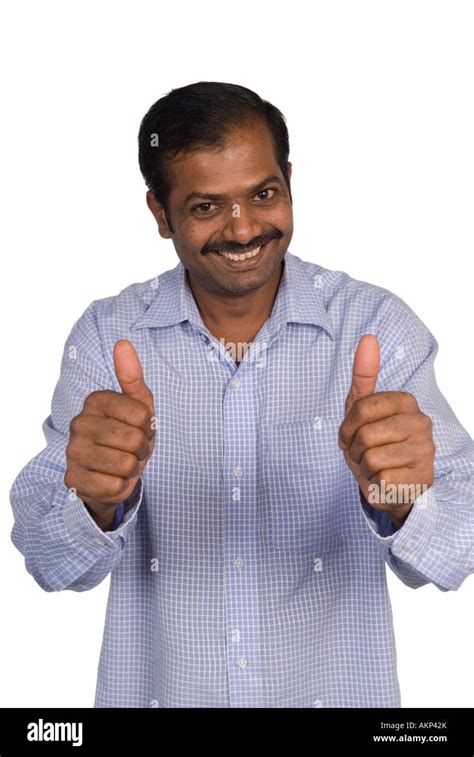 Mature Indian man thumbs up Stock Photo - Alamy