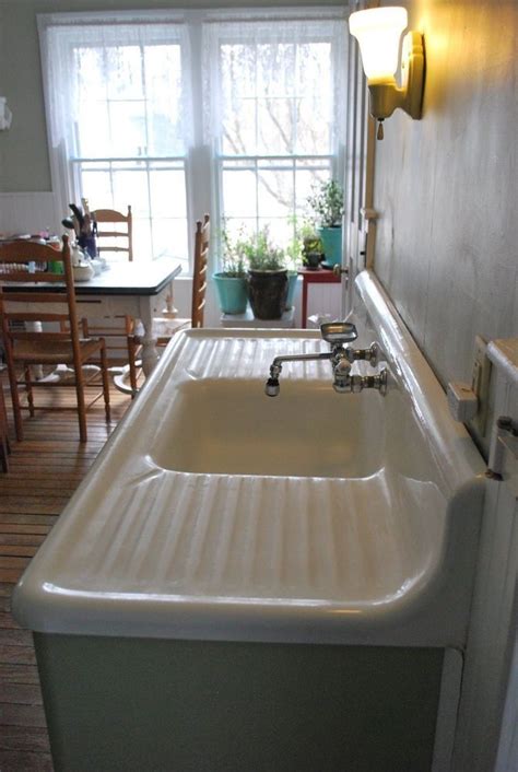 Antique white porcelain cast iron kitchen sink with double drainboard ...