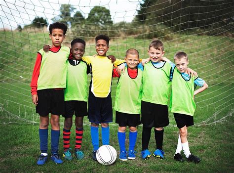 Junior football team standing together | Free Photo - rawpixel