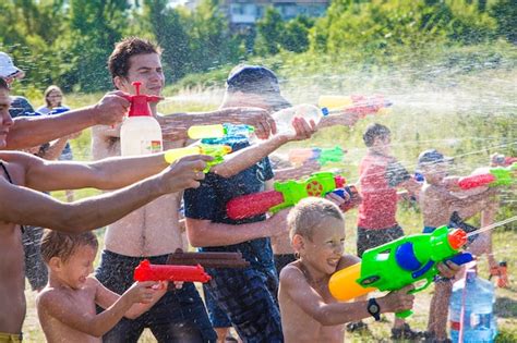 Premium Photo | Children playing water battle water game battle