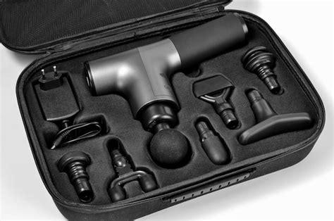 Premium Photo | Massage gun in a case handheld cordless professional percussion deep tissue body ...