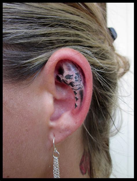 Mini Skull, ear tattoo by CAMOSartTATTOO on DeviantArt