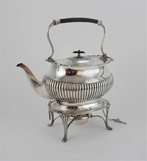 Lot - A sterling silver tea kettle on stand, 1702 grams, 54.72 troy oz.