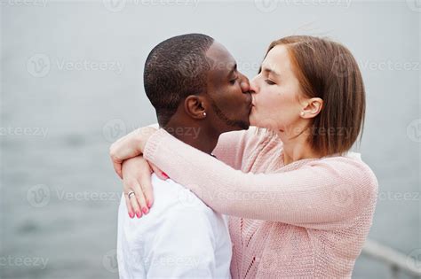 Happy multiethnic couple in love story. Relationships of african man and white european woman ...