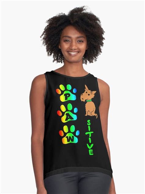 Pawsitive. Funny positive pun. Colorful rainbow dog paw prints and a little brown dog cartoon ...