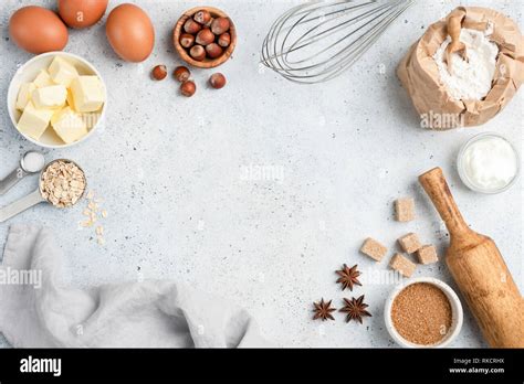 Baking ingredients and utensils on concrete background. Cooking or baking cake, cookies, pastry ...