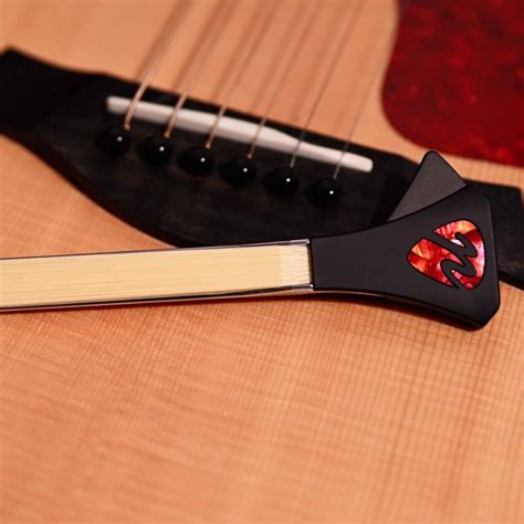 The new patent pending Guitar bow that transforms any acoustic guitar into a bowed instrument ...