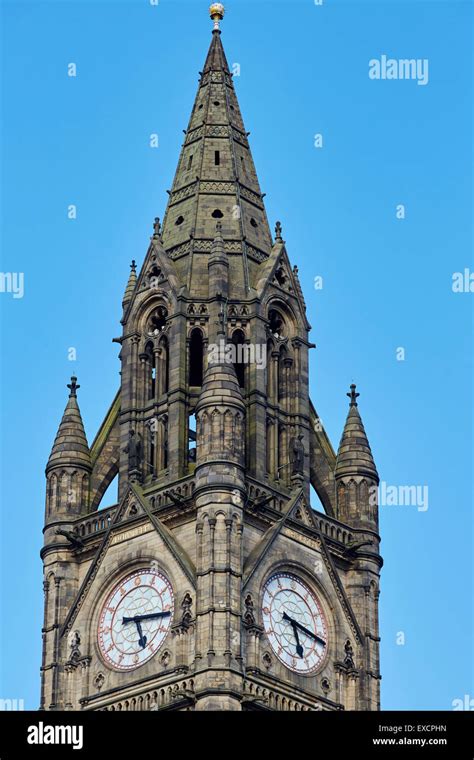 Close-up of manchester Town hall clock tower exterior Clock face roman numerals numbers time ...