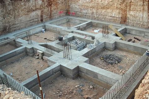 an unfinished concrete structure with people standing around it in the ...