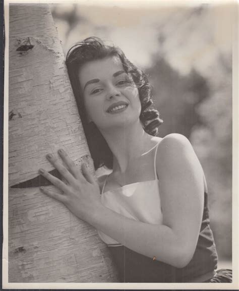 Brunette sleveless top hugs white birch tree glamor photo 1950s