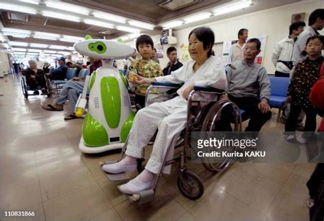 Japan Introduces First Hospital Robot Guide Photos and Premium High Res Pictures - Getty Images