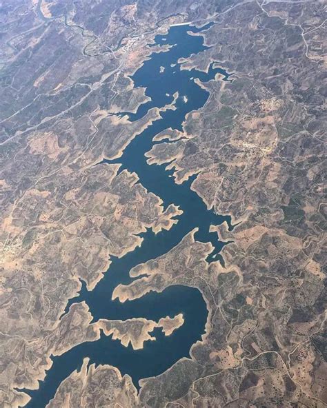 The "Blue Dragon River" River Odeleite, Portugal seen from space : interestingasfuck