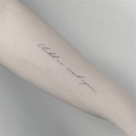 “Until we meet again” tattoo on the left forearm.