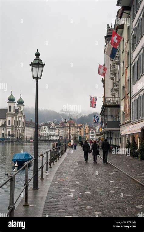 LUCERNE, SWITZERLAND - FEBRUARY 04, 2010: Lucerne in winter. Fog, rain ...