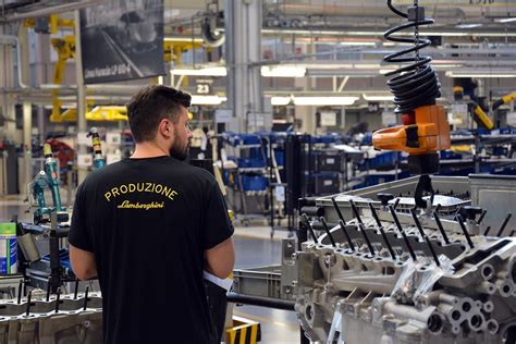 Employees wear a black Lamborghini uniform that clearly indicates whether they’re assembly line ...