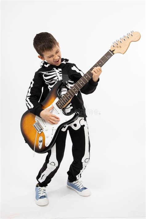 Portrait of Young Boy Playing Electric Guitar. Boy Playing the Guitar ...