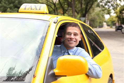 Taxi driver near car Stock Photo by ©belchonock 124917716