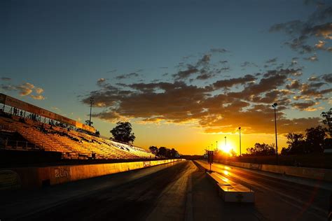 Sunset Racing Sports Raceway Cloud Racetrack-12 Inch By 18 Inch Laminated Poster With Bright ...