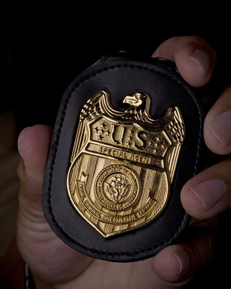 File:NCIS Badge in hand.jpg - Wikimedia Commons