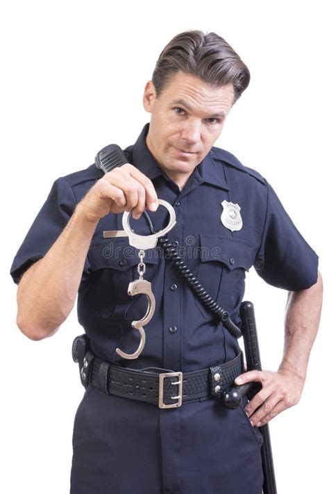 Uniformed Police Officer Holding Handcuffs Stock Image - Image of attractive, hold: 63843421