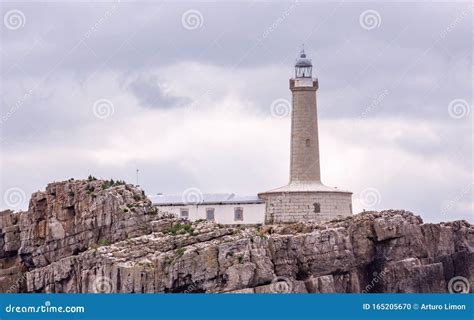 Lighthouse in a Rocky Island Stock Photo - Image of navigation, lighthouse: 165205670