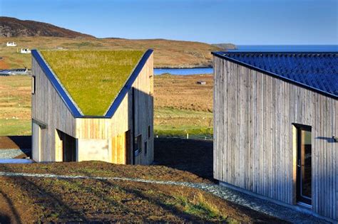 Green-Roofed Turf House in Scottish Landscape