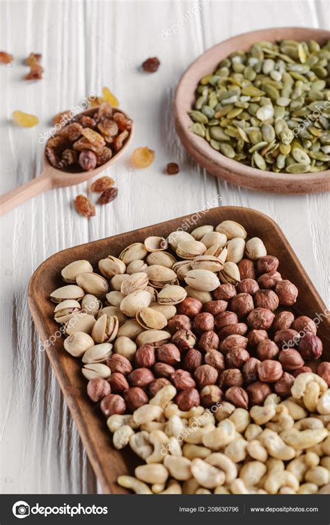 Variety Nuts Raisins White Wooden Table — Stock Photo © VadimVasenin ...