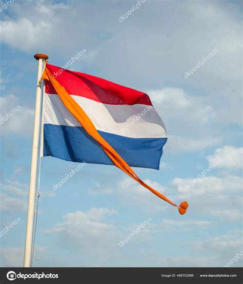 Dutch flag with orange pennant Stock Photo by ©compuinfoto 468702086