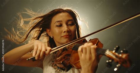 Professional female violin player performing an amazing solo during ...