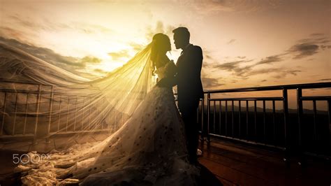 wedding couple with the sunset - Bride and Groom at Sunset Romantic Married Couple | Wedding ...