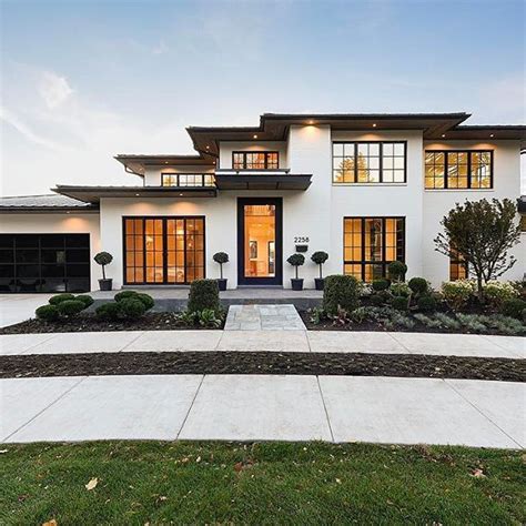 Modern white and black exterior. Black windows, painted white brick ...