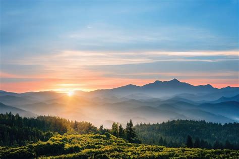 Premium Photo | Beautiful ancient mountains at sunset in the evening sunlight and in the fog