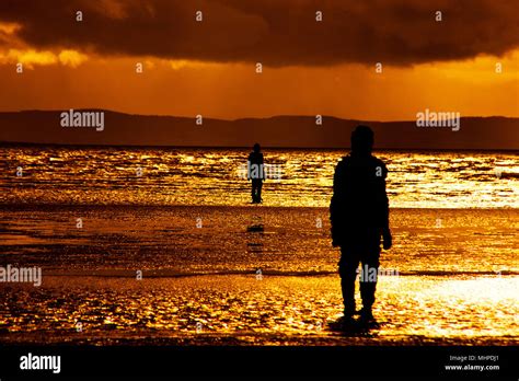 Statues on Crosby Beach - Southport UK Stock Photo - Alamy