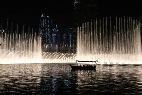 Free Images : night, fountain, reflection, water feature, light ...