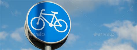 Round road sign depicting white bicycle on blue background, meaning ...