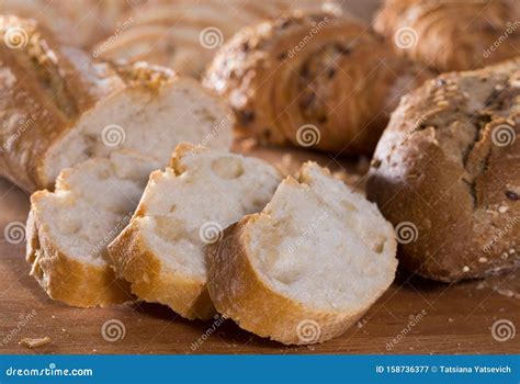 Slices of Wheaten Bread on Wooden Surface Stock Image - Image of meal, closeup: 158736377