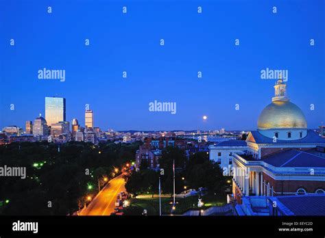 USA, Massachusetts, Boston, View of Massachusetts State House Dome and city skyline at moonrise ...