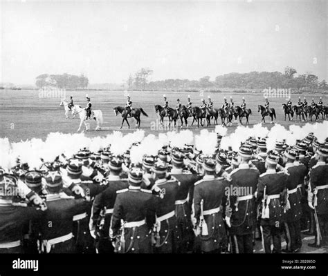 Officers ride past lined-up soldiers as part of a military parade in ...