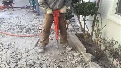 Jack Hammering Concrete With High Powered Air Jack Hammer - YouTube