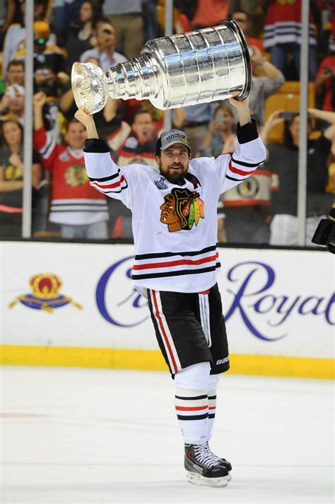 Patrick Sharp Hoists Stanley Cup - 2013 | HockeyGods